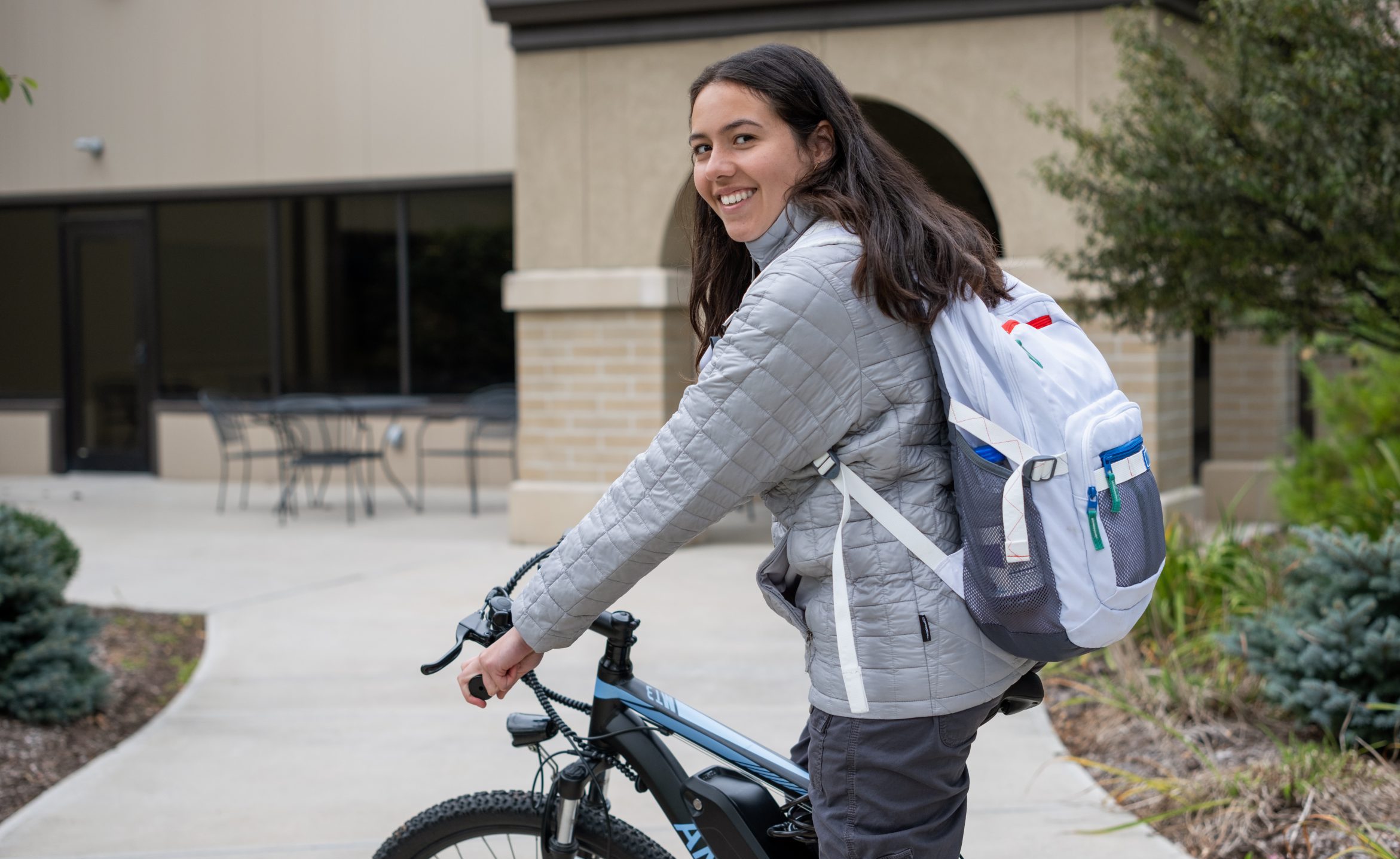 Lourdes Student on Bike